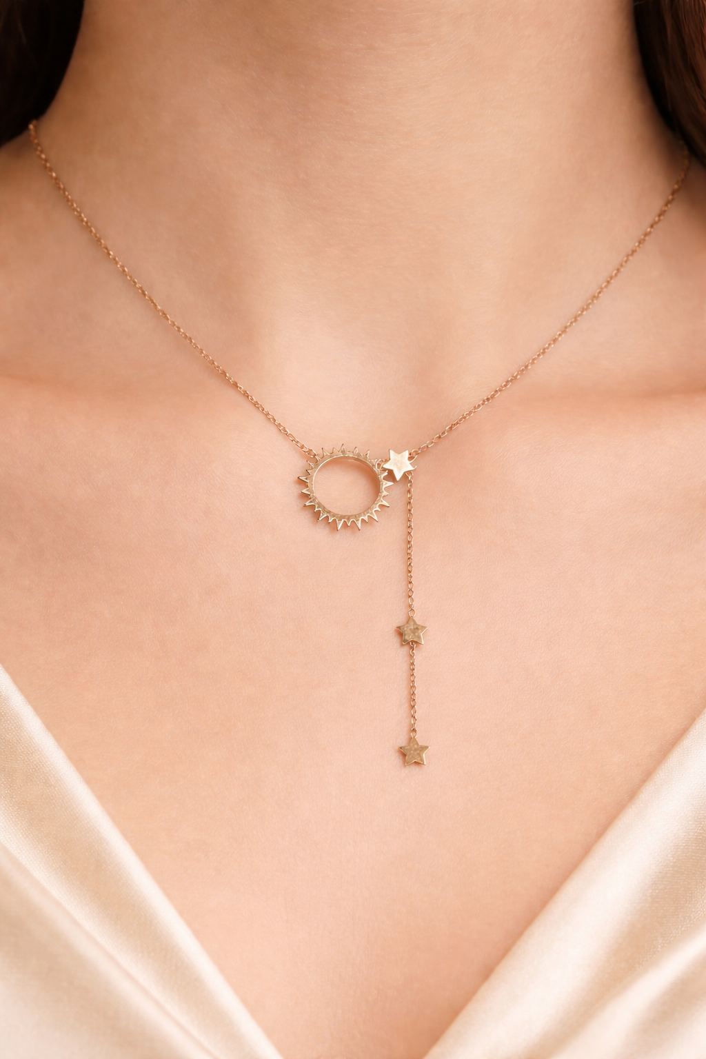 Ashaarya, Anti Tarnish, ashaarya jewels,Charm bracelets, Rose gold necklace with star pendants on a person wearing a white top.