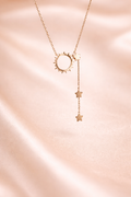 Anti Tarnish Necklace, Ashaarya, Ashaarya Jewels, Ashaarya jewellery, Rose gold necklace with sun and star pendants on a pink satin background