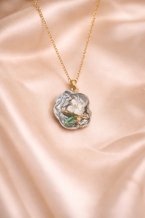 Love pearl necklace, Ashaarya, Ashaarya jewels, Ashaarya jewellery, anti-tarnish necklace with a pendant on a pink satin background