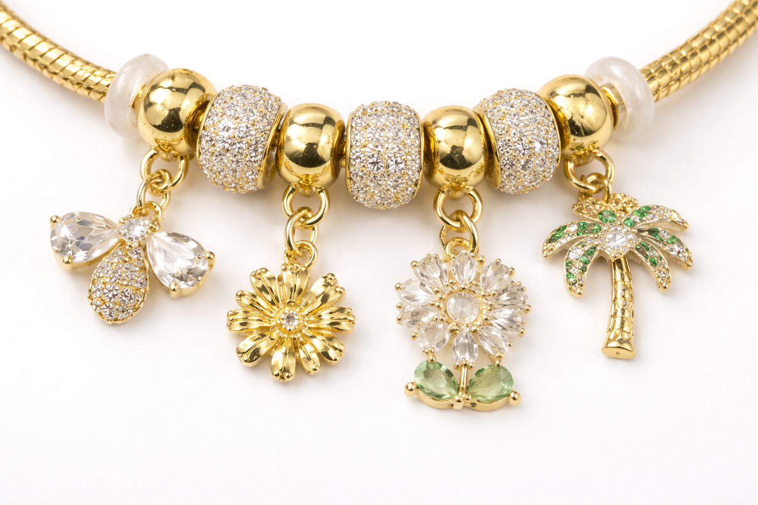 Anti-tarnish charm bracelet for women with butterfly, flower and palm charms in 18KT gold tone with American diamonds – comfort jewellery by Ashaarya