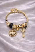 Anti-tarnish charm bracelets for women by Ashaarya featuring bee charm, heart lock key charm, black crystal beads and pearl accents designed as comfort jewellery.