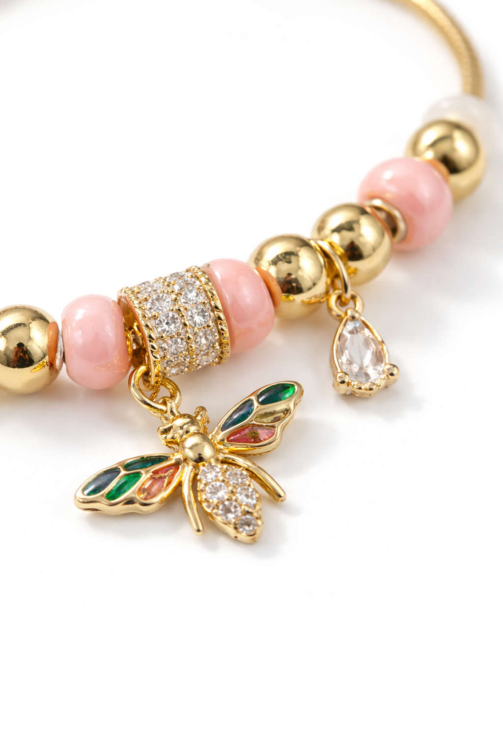 Anti-tarnish comfort jewellery charm bracelet for women with butterfly charm, pink beads and American diamonds in 18KT gold tone – demi-fine charm bracelets jewellery by Ashaarya