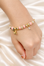 Anti-tarnish comfort jewellery charm bracelet for women with butterfly charm, pink beads and American diamonds in 18KT gold tone – demi-fine charm bracelets jewellery by Ashaarya