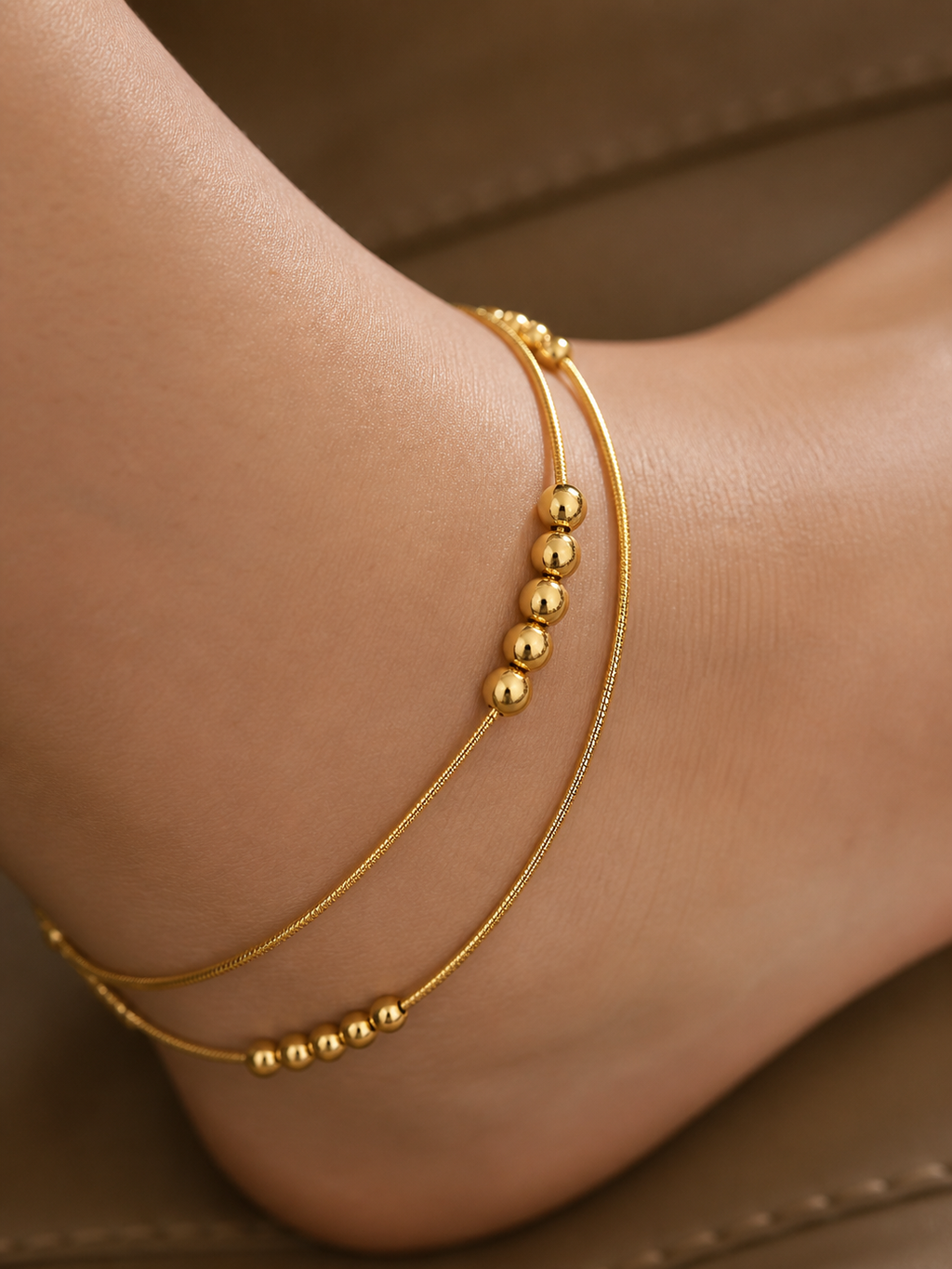 anti-tarnish comfort jewellery gold anklet with smooth bead design, lightweight adjustable anklet for women, minimal everyday anklet flat lay