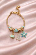 Anti-tarnish charm bracelets for women by Ashaarya, ocean inspired demi-fine charm bracelet with turquoise starfish and seashell charms, lightweight comfort jewellery.