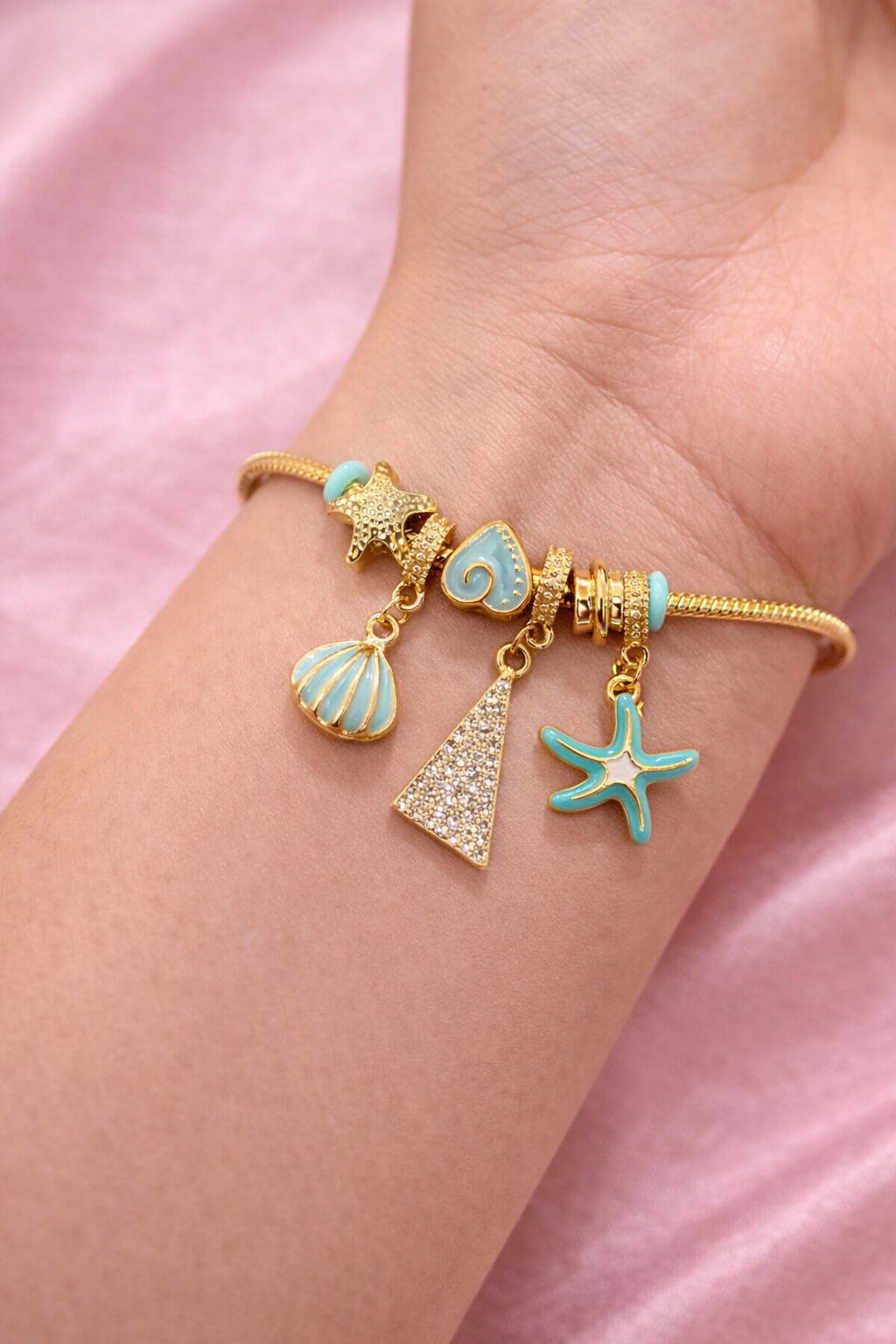 Anti-tarnish charm bracelets for women worn on wrist, ocean charm bracelet in turquoise and gold, lightweight comfort jewellery by Ashaarya.