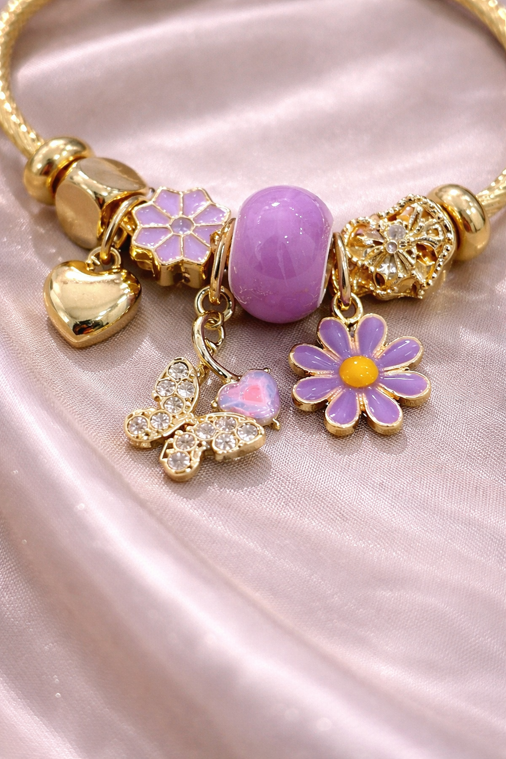 anti-tarnish charm bracelet for women with lavender flower charms butterfly charm and gold heart charm by Ashaarya comfort jewellery