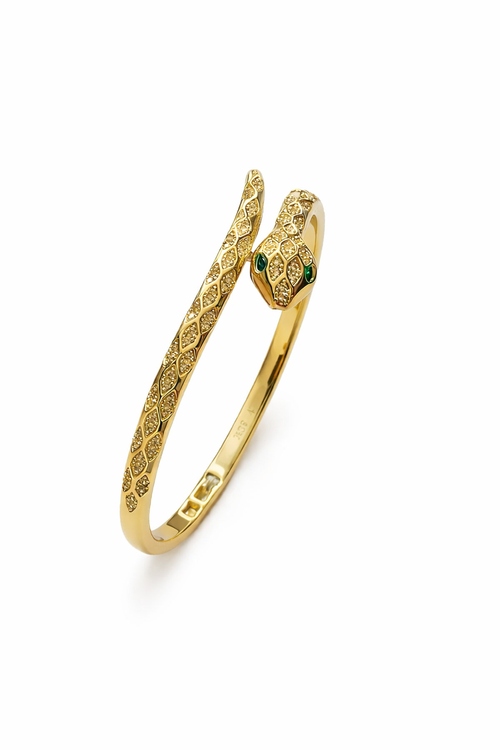 Close-up detail of anti-tarnish snake bracelet for women showing serpent head with green stone eyes and textured scale pattern in Ashaarya comfort jewellery.