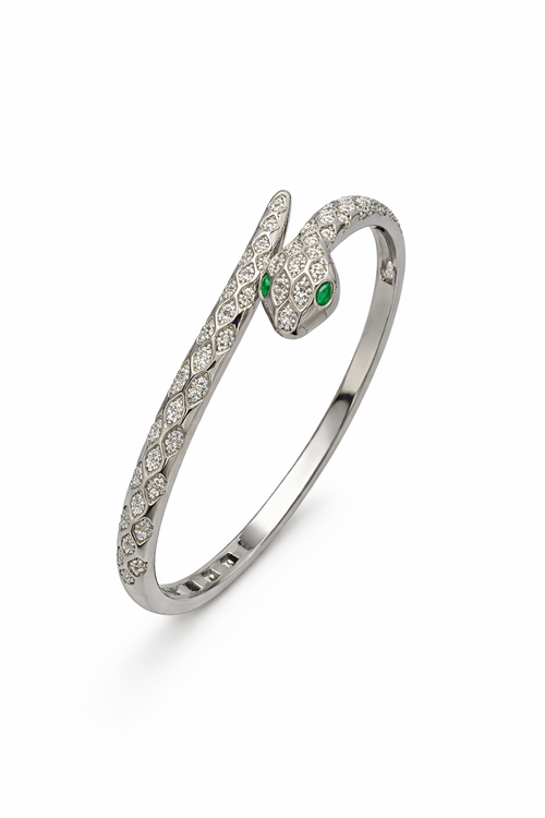 Close-up of anti-tarnish snake bracelet head showing emerald green eyes and diamond scale detailing in Ashaarya comfort jewellery.