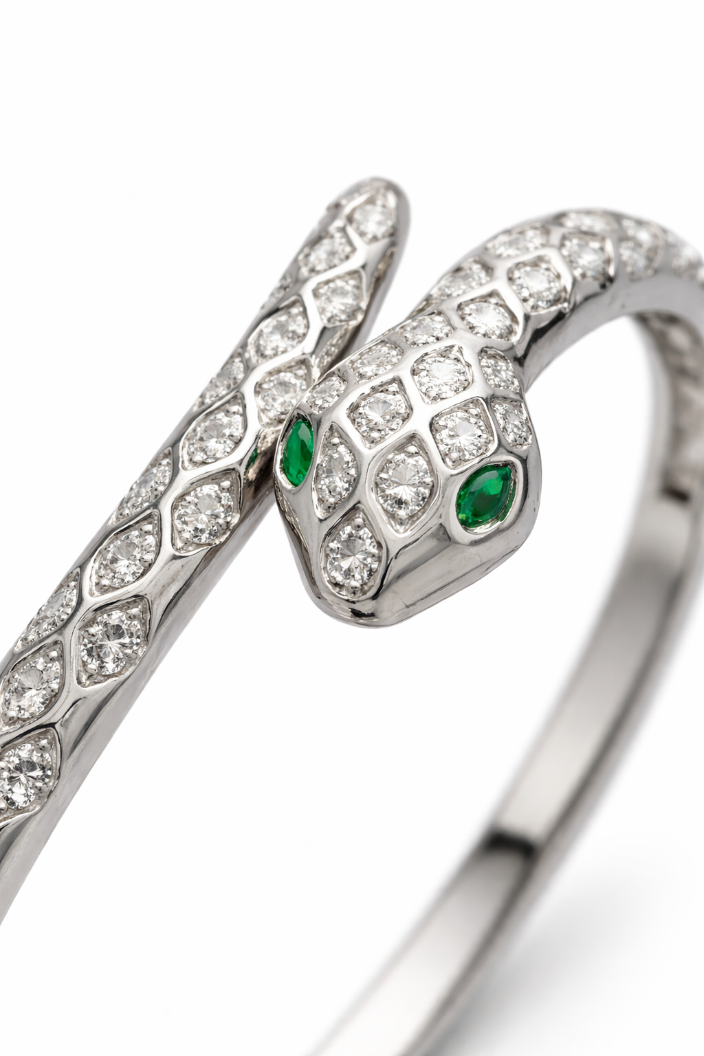 Anti-tarnish snake bracelet for women with emerald green eyes and diamond scale detailing from Ashaarya comfort jewellery collection.