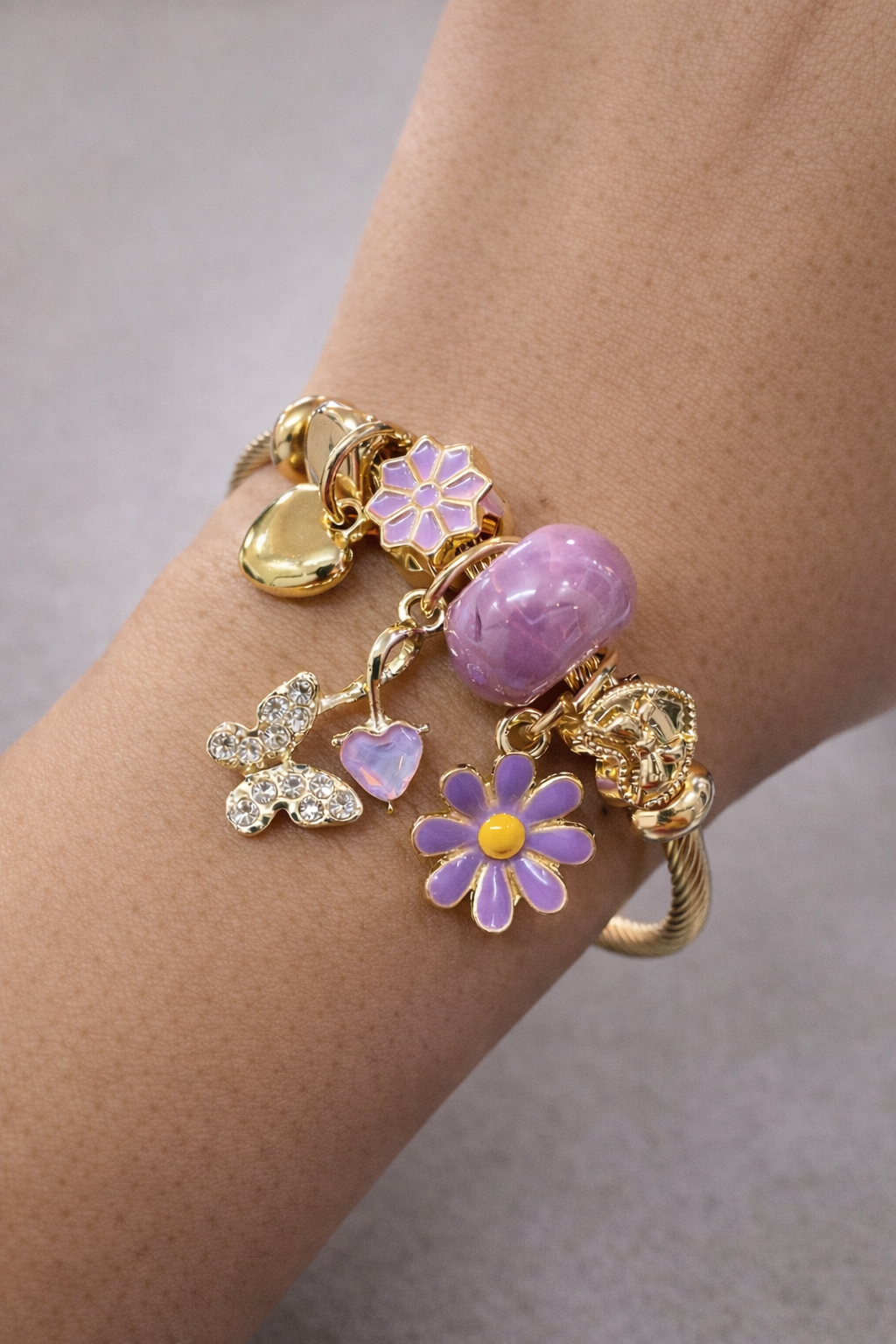 anti-tarnish charm bracelet for women with lavender flower charms butterfly charm and gold heart charm by Ashaarya comfort jewellery