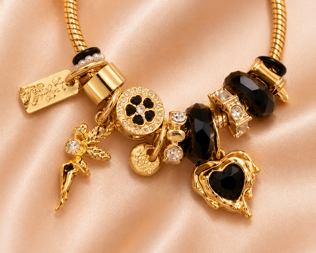 Close-up of Black Diva charm bracelet featuring black crystal beads and luxury charms